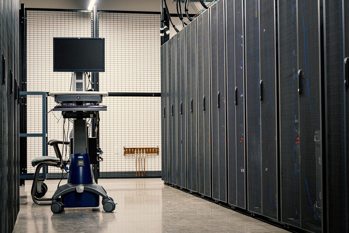 Rows of server racks inside a data center