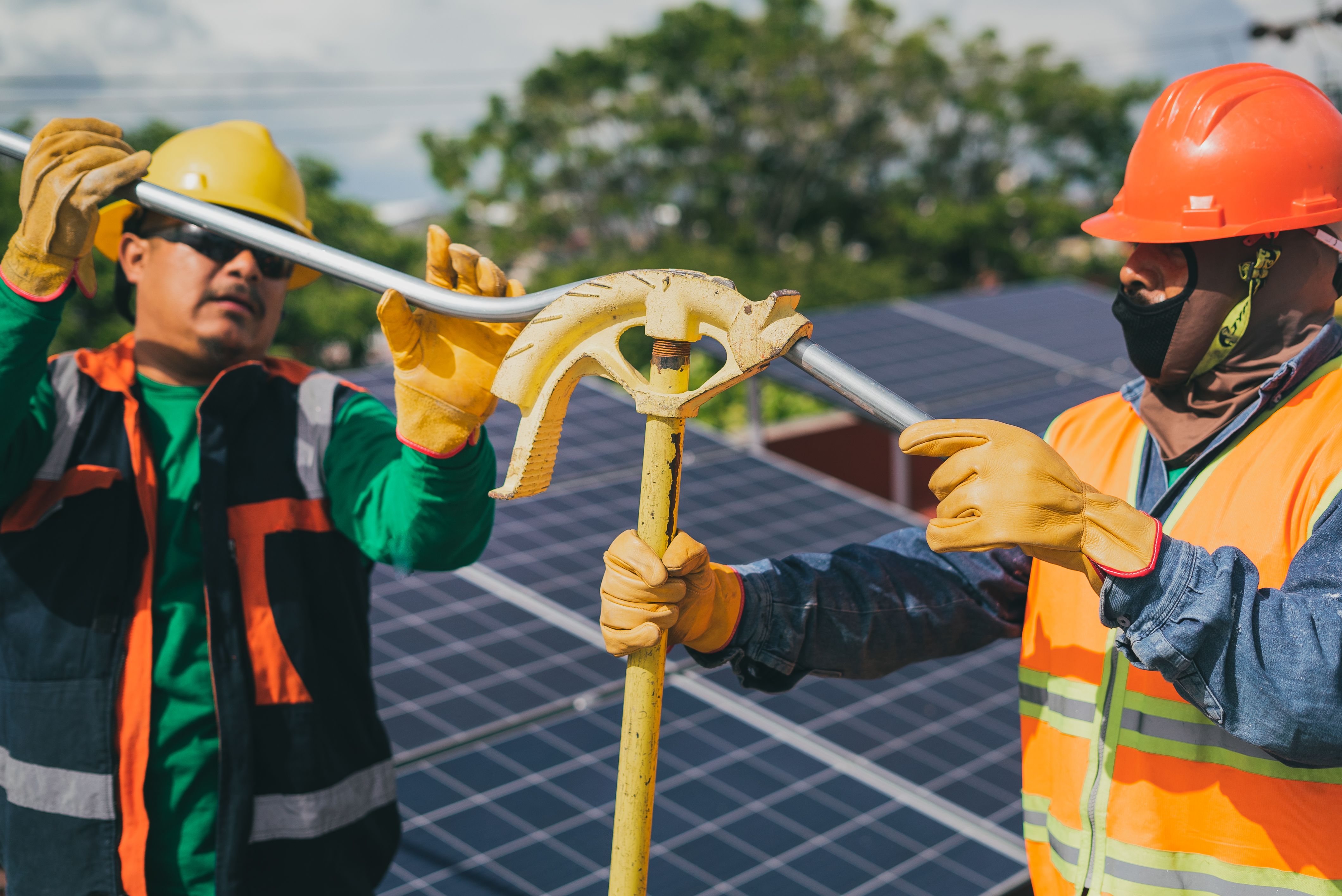 Technicians installing a solar system on site