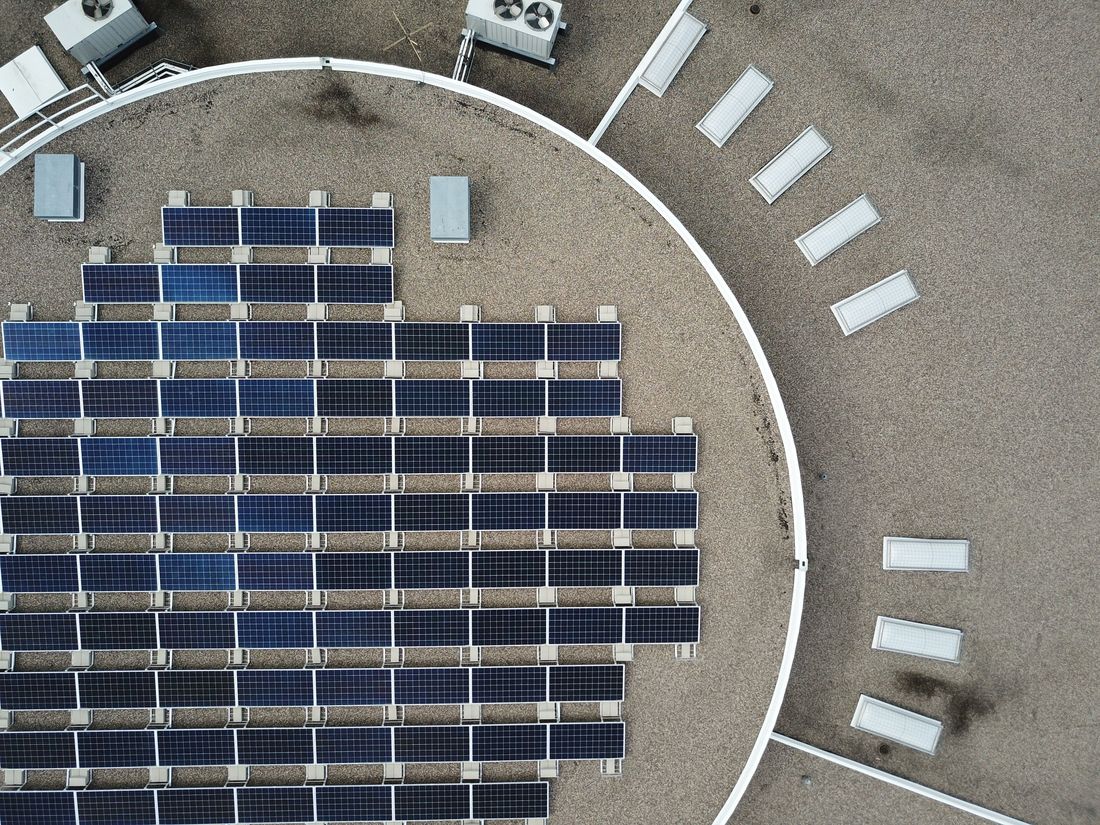 Aerial view of a large rooftop solar array